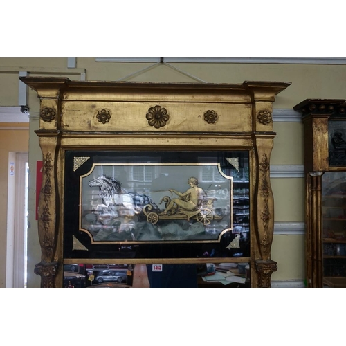 1452 - An unusually large Regency gilt framed pier mirror, the frieze reverse glass decorated with a classi... 