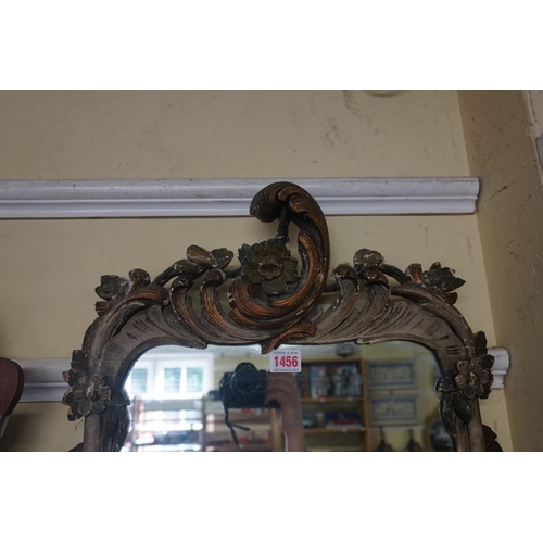 1456 - An 18th century Continental rococo carved and painted wood frame wall mirror, 87 x 44.5cm.... 