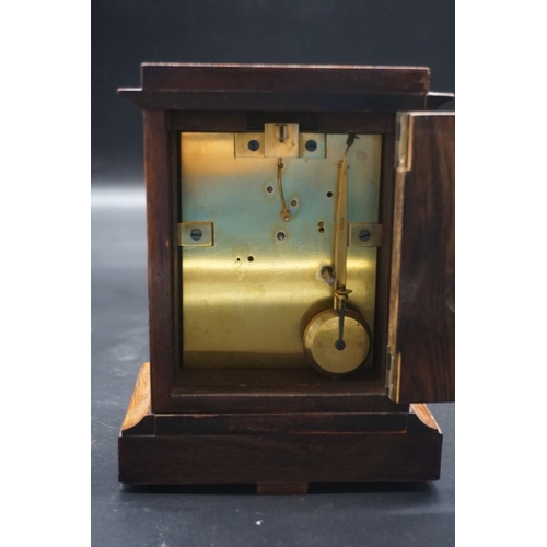 1463 - A small late 19th century rosewood mantel timepiece, 17cm high, with pendulum. ... 