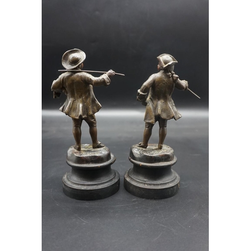 1464 - A pair of spelter figures, each on ebonized socle, 19cm high. 