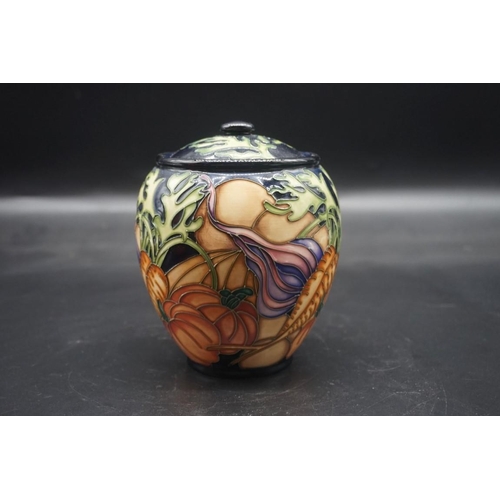 1492 - Two Moorcroft vases, comprising: 'a Vegetable Patch' pattern jar and cover, 15cm high; and a 'Bullru... 