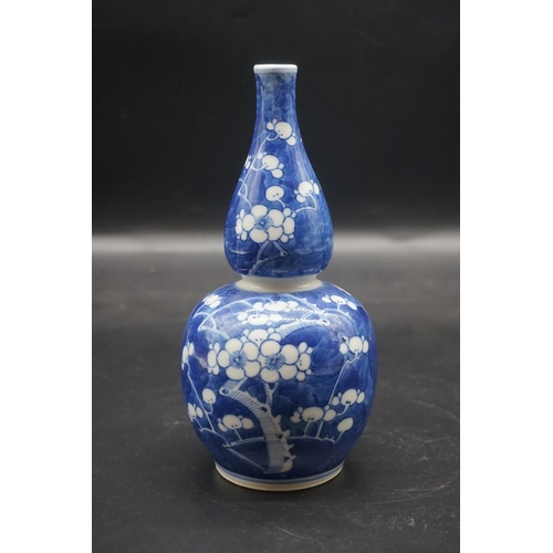 1504 - Two Chinese blue and white prunus vases, the largest of double gourde form, and with Kangxi four cha... 