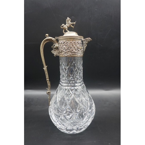 1521 - A plated metal mounted cut glass claret jug; together with another plated metal example, latter 33cm... 