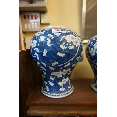 1530 - Two similar Chinese blue and white prunus jars, Qing, largest 32cm high.