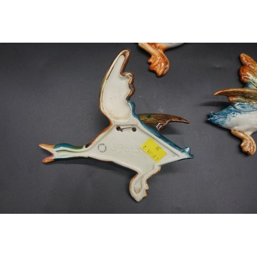 1547 - A graduated part set of three Beswick mallard wall plaques, largest 22cm long.