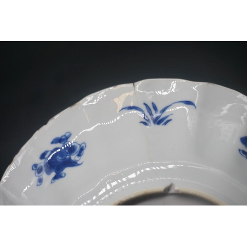 1554 - A large Chinese blue and white plates, Kangxi four character mark to base, painted with fish, 30cm d... 