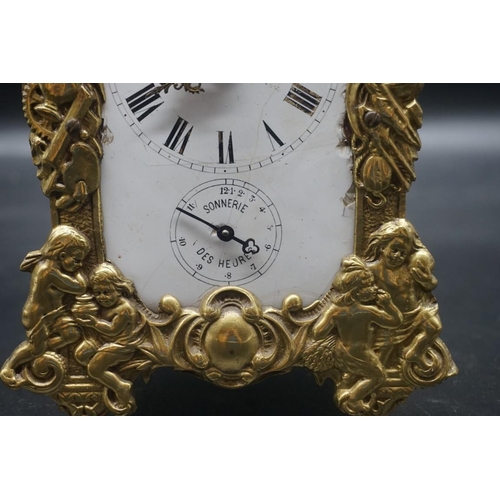 1557 - An antique French cast brass mantel clock, with enamel dial, 24cm high.