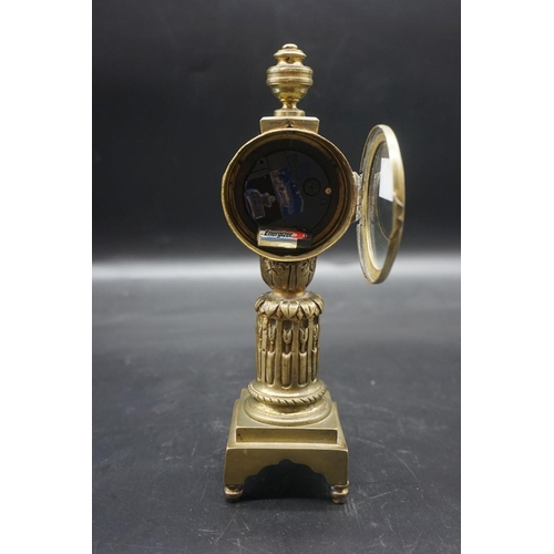 1559 - An antique Continental brass pillar timepiece, with 2 1/4in enamel dial, 23cm high, (with later batt... 