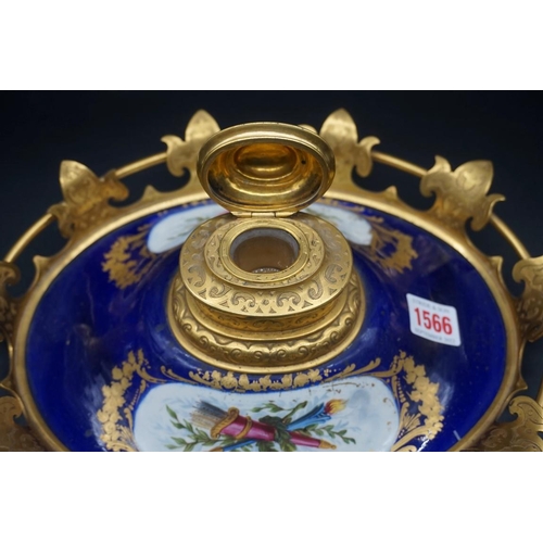 1566 - An elaborate 19th century porcelain and gilt brass mounted inkwell, 30cm wide; together with a simil... 