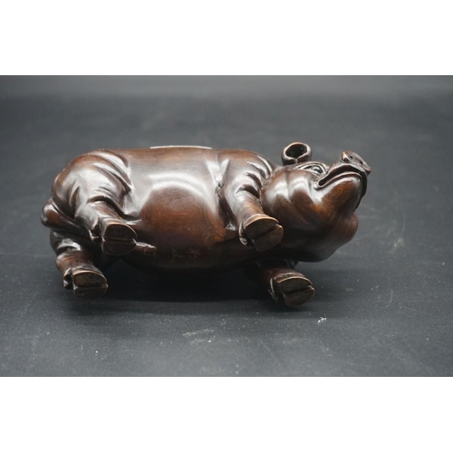 1567 - A pair of Chinese or Japanese carved hardwood pigs, each signed, approx 15cm long.