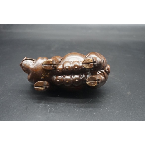 1567 - A pair of Chinese or Japanese carved hardwood pigs, each signed, approx 15cm long.