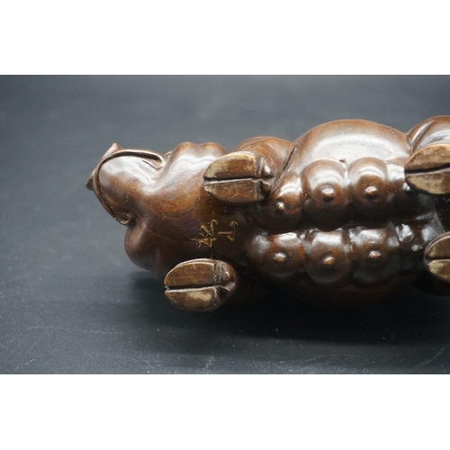 1567 - A pair of Chinese or Japanese carved hardwood pigs, each signed, approx 15cm long.