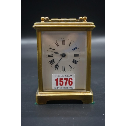 1576 - An antique brass carriage timepiece, height including handle 14.5cm, in original leather travel case... 