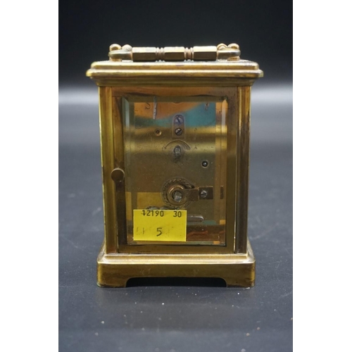 1576 - An antique brass carriage timepiece, height including handle 14.5cm, in original leather travel case... 