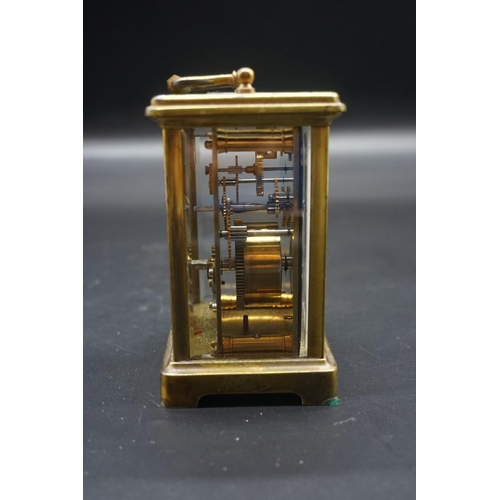 1576 - An antique brass carriage timepiece, height including handle 14.5cm, in original leather travel case... 