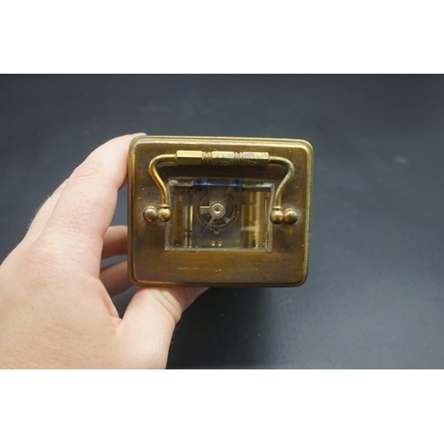 1576 - An antique brass carriage timepiece, height including handle 14.5cm, in original leather travel case... 