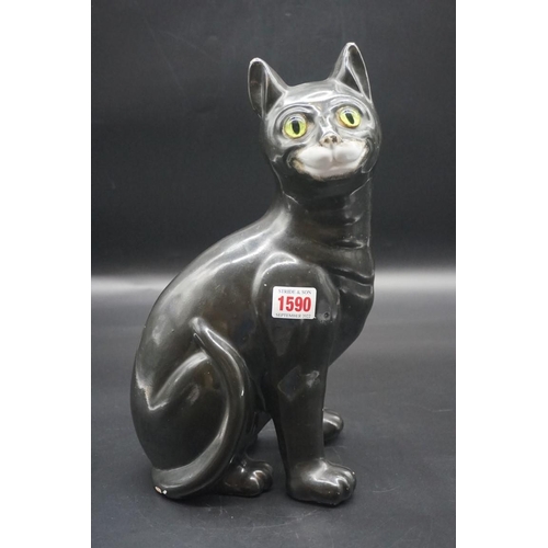 1590 - A Galle black glazed faience cat, signed, with green glass eyes, 36cm high, (s.d).