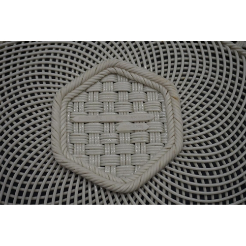 1597 - A Belleek twin handled hexagonal lattice plate, 26cm wide, (s.d.).