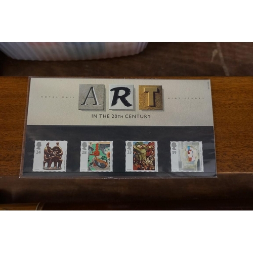 1609 - Stamps: a small collection of FDCs; presentation packs; and an album.