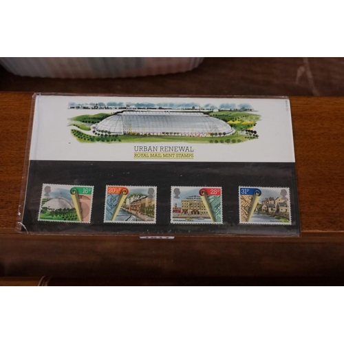 1609 - Stamps: a small collection of FDCs; presentation packs; and an album.