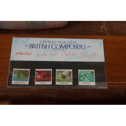 1609 - Stamps: a small collection of FDCs; presentation packs; and an album.