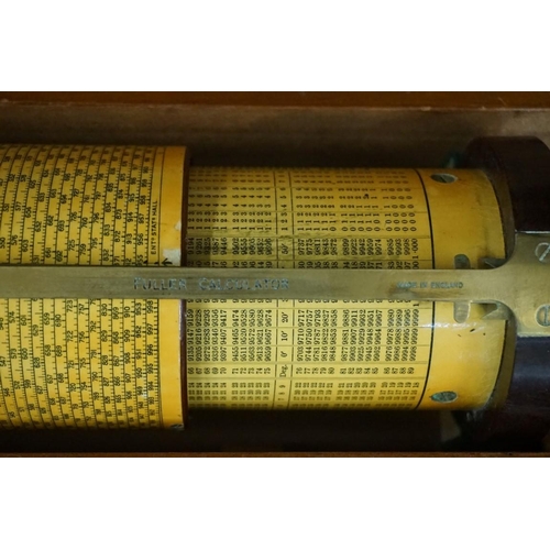 1611 - A vintage Fuller cylindrical slide rule, the Bakelite ends inscribed 'Stanley', in mahogany fitted b... 