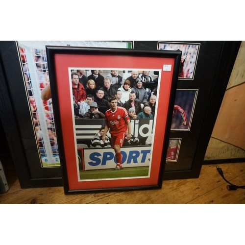 1611A - Liverpool FC: a signed photograph of Steven Gerrard, I.36 x 24cm; and another of Luis Suarez. (2)... 