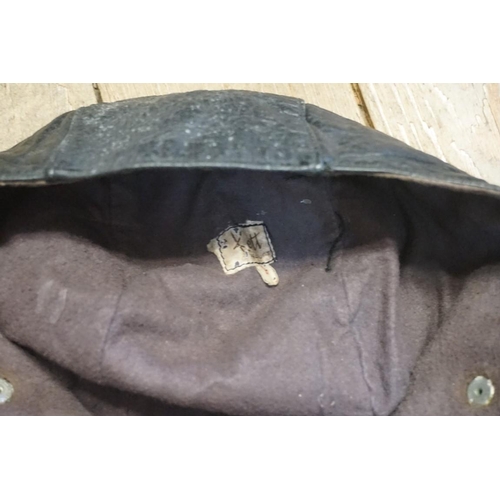 1615 - Two vintage leather flying helmets, one inscribed 'A Kett'. (2)