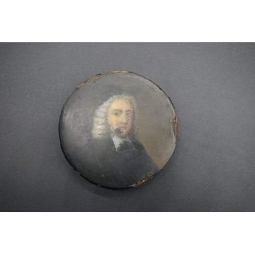 1657 - A Stobwasser style circular box and cover, the cover painted with a bust length portrait of a cleric... 