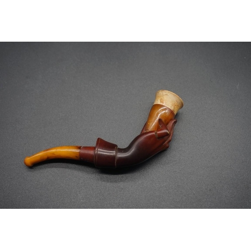 1678 - A small antique carved amber and meerschaum pipe, 10.5cm long, (repair to little finger), in le... 