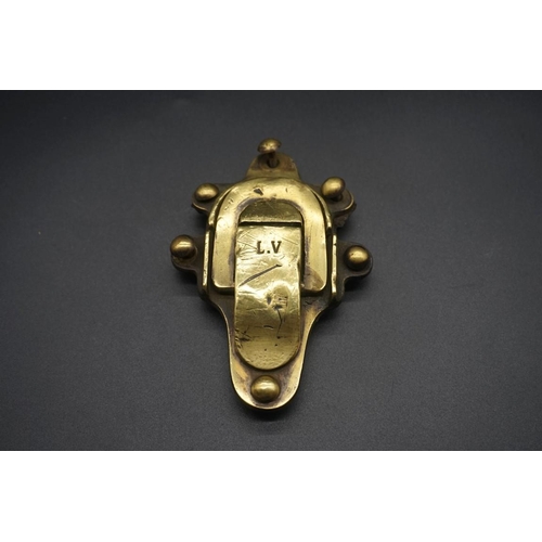 1679 - A pair of Louis Vuitton brass trunk clasps, late 19th century, each with six rivets, 10.5 x 7.5cm.... 