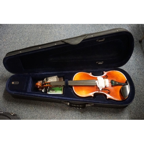 1708 - Five various violins, each with bow and in padded case. 