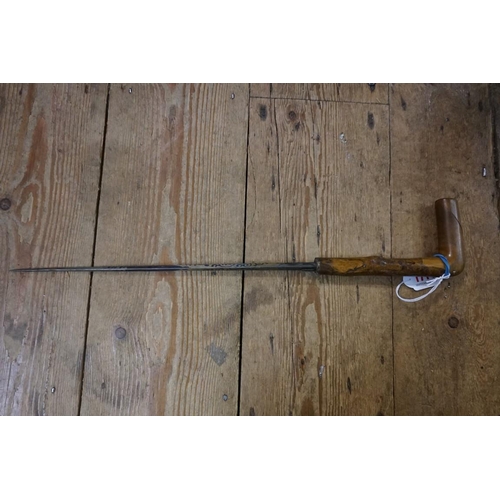 1714 - An antique sword stick, with Damascus quatreform 34cm blade.