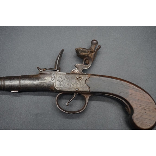 1739 - An antique cannon barrel flint lock pocket pistol, by 'T Coe, Cambridge', having walnut grip, overal... 