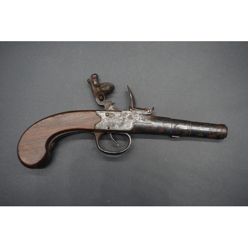 1739 - An antique cannon barrel flint lock pocket pistol, by 'T Coe, Cambridge', having walnut grip, overal... 