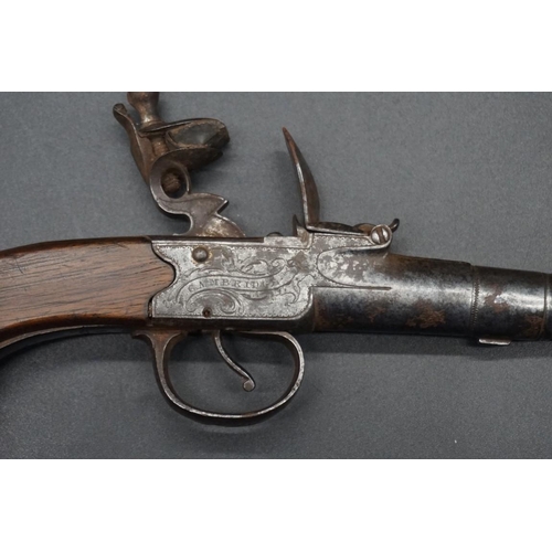 1739 - An antique cannon barrel flint lock pocket pistol, by 'T Coe, Cambridge', having walnut grip, overal... 