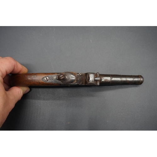 1739 - An antique cannon barrel flint lock pocket pistol, by 'T Coe, Cambridge', having walnut grip, overal... 