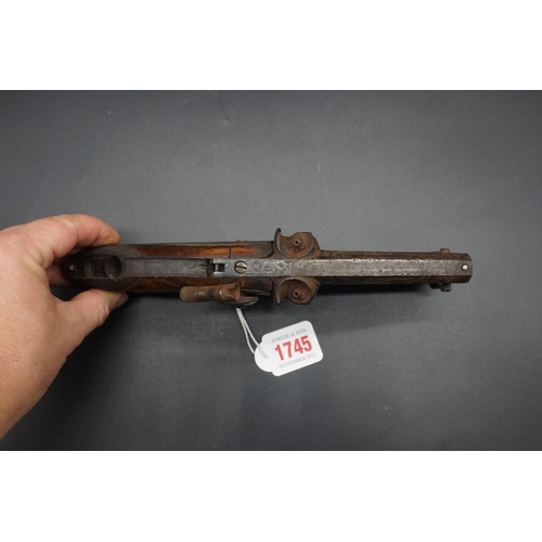 1745 - An antique double barrel percussion pistol, by 'Parkinson', overall length 24cm; together with anoth... 