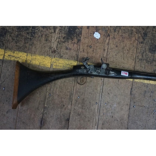 1746 - An antique Arab flintlock musket, 201cm.