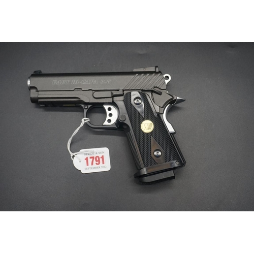 1791 - A WE Baby Hi-Capa 38.8 .45 cal gas airsoft pistol, with additional magazine, in box. VCR act applies... 