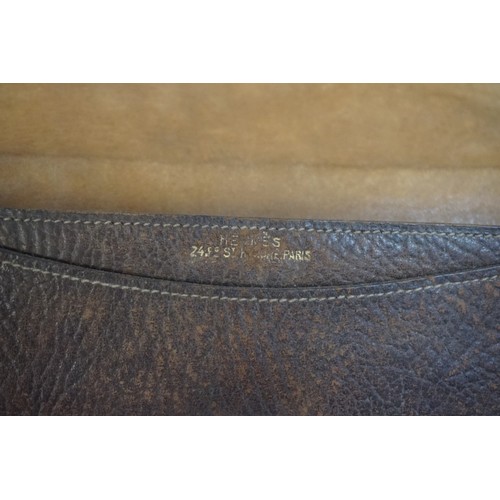 1315 - WITHDRAWN FROM SALE: A vintage Hermes small leather bag or purse, with monogrammed metal clasp 23cm ... 