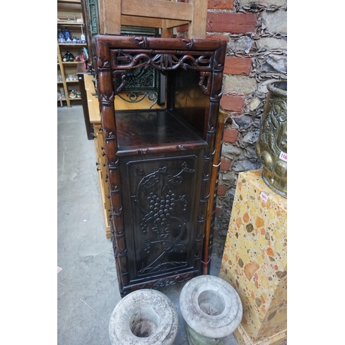 1074 - A late 19th/early 20th century Chinese carved hardwood side cabinet, with an open tier above six lon... 