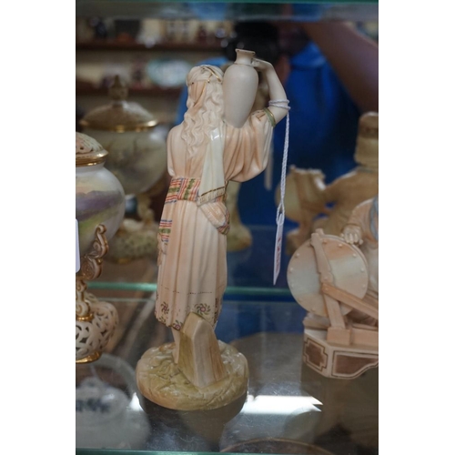 1258 - A Victorian Royal Worcester blush ivory figure of a water carrier, circa 1891, 20.5cm high.... 