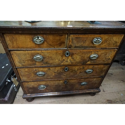 1355 - A George I figured walnut and crossbanded chest of drawers, on bun feet, 92.5cm wide.... 