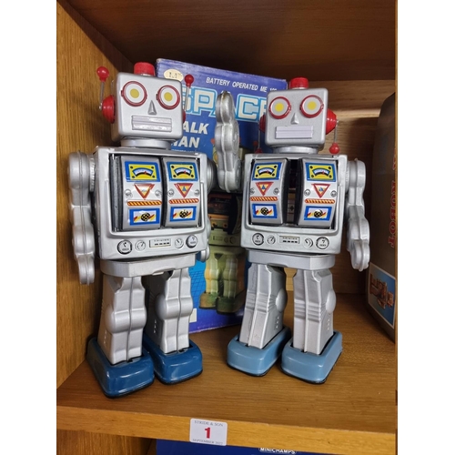 1 - Robots: two vintage battery operated 'Space Walk Man' robots, with one original box.... 