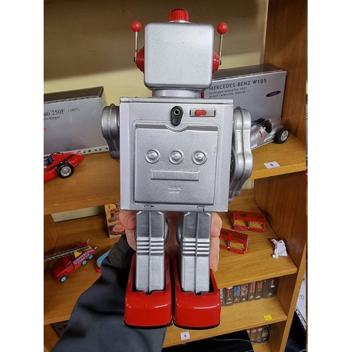 2 - Robots: a vintage battery operated Made In Japan 'Gear' robot with original box.