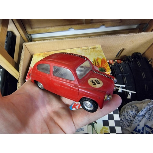 24 - Scalextric: a vintage Scalextric set, comprising: seven cars, to include Javelin C4-10; Mini Cooper ... 