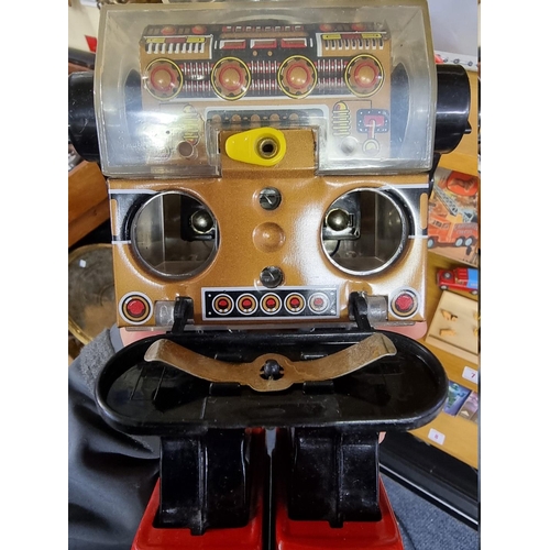 3 - Robots: a vintage (circa 1970s) battery operated 'Piston' robot, possibly by Horikawa, with remains ... 