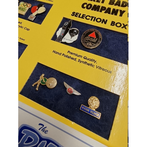 34 - Rocket Badge Company: a product sample box, containing 25 pin badges in various finishes, cufflinks,... 