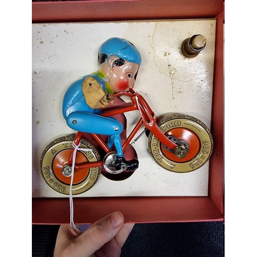 38 - Triang: a Gyro-Cycle tinplate toy, in original box.